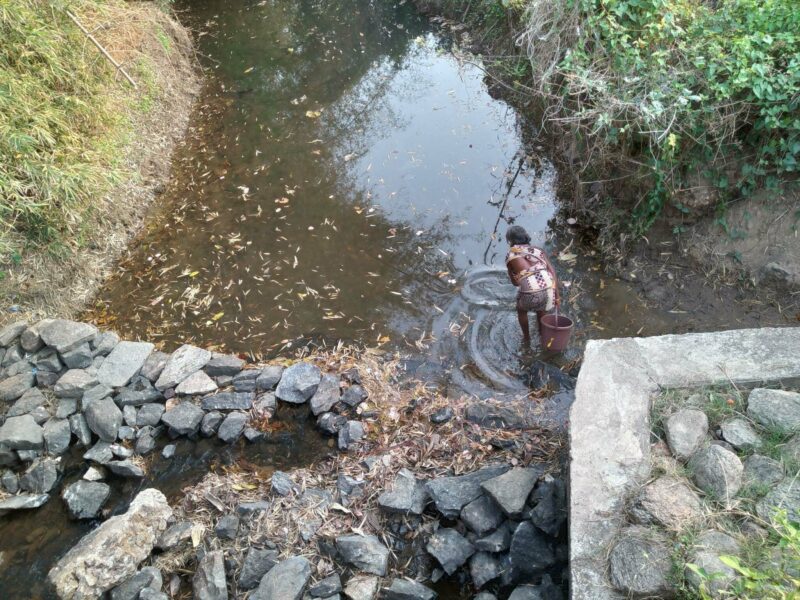 F2 Woman fetching water