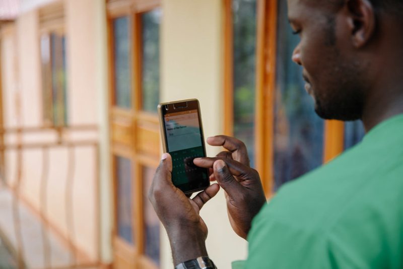 Farmer using phone Photo by CTA ACP EU