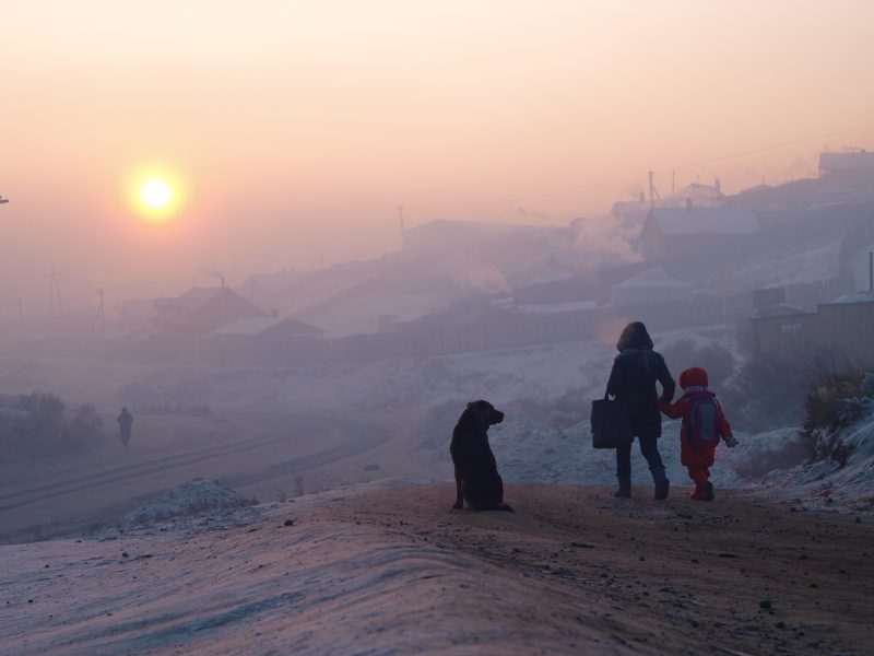 Children in Ulaanbaatar's smoggy streets at dawn